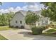 Charming home with gray siding, stone accents, and a well-manicured lawn. A two car garage included at 2916 Reynolda Cir, Durham, NC 27712