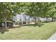 Charming home exterior with well-manicured lawn, mature trees, and neat landscaping at 2916 Reynolda Cir, Durham, NC 27712
