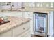 Stylish kitchen features granite countertops, white cabinets, and a built-in wine cooler for added convenience at 2916 Reynolda Cir, Durham, NC 27712