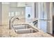 Bright kitchen features stainless steel sink, granite countertops, and stainless steel appliances at 2916 Reynolda Cir, Durham, NC 27712