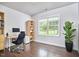 Functional home office space featuring a large window, a modern desk, and ample storage at 2916 Reynolda Cir, Durham, NC 27712