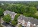 Aerial view of townhomes surrounded by lush greenery at 2921 Imperial Oaks Dr, Raleigh, NC 27614