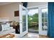 Living room balcony featuring French doors, offering a view of the trees at 2921 Imperial Oaks Dr, Raleigh, NC 27614