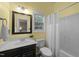 Bathroom features vanity, mirror, and shower/tub combo with a window at 2921 Imperial Oaks Dr, Raleigh, NC 27614