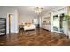 Large bedroom features hardwood floors, a ceiling fan, and a glass sliding door at 2921 Imperial Oaks Dr, Raleigh, NC 27614