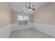 A carpeted bedroom features neutral walls and a window with ample natural light at 2921 Imperial Oaks Dr, Raleigh, NC 27614