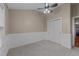 Bright bedroom offers carpet floors, a ceiling fan, and large closet at 2921 Imperial Oaks Dr, Raleigh, NC 27614