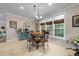 Bright breakfast nook with a round table set, neutral walls, and large windows at 2921 Imperial Oaks Dr, Raleigh, NC 27614