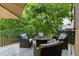 A covered deck features comfortable outdoor seating and an inviting spot for relaxation at 2921 Imperial Oaks Dr, Raleigh, NC 27614