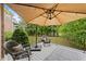 Outdoor deck features rocking chairs and an umbrella perfect for entertaining guests at 2921 Imperial Oaks Dr, Raleigh, NC 27614