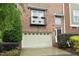 Attractive townhome exterior with a garage and balcony at 2921 Imperial Oaks Dr, Raleigh, NC 27614