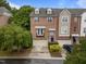 Exterior view of a brick townhome with balcony and garage at 2921 Imperial Oaks Dr, Raleigh, NC 27614