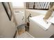 Top-down view of a bright foyer with hardwood floors, staircase with wrought iron railing, and decorative accents at 2921 Imperial Oaks Dr, Raleigh, NC 27614