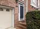 Inviting front entrance with brick steps and a black door at 2921 Imperial Oaks Dr, Raleigh, NC 27614