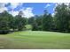 Scenic view of the meticulously maintained golf course and lush greenery at the community at 2921 Imperial Oaks Dr, Raleigh, NC 27614