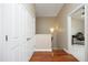 Hallway features wood floors and leads to a bedroom that may serve as an office at 2921 Imperial Oaks Dr, Raleigh, NC 27614