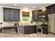 Updated kitchen features granite countertops, stainless steel appliances, and custom cabinetry at 2921 Imperial Oaks Dr, Raleigh, NC 27614