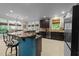Open kitchen layout features granite countertops, stainless appliances, and a breakfast bar with seating at 2921 Imperial Oaks Dr, Raleigh, NC 27614