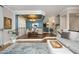 Bright and airy living room featuring hardwood floors, an accent wall, and comfortable neutral-toned furnishings at 2921 Imperial Oaks Dr, Raleigh, NC 27614