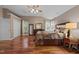 A spacious main bedroom offers hardwood floors, a ceiling fan, and ample natural light at 2921 Imperial Oaks Dr, Raleigh, NC 27614