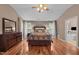 Spacious main bedroom featuring hardwood floors, ceiling fan, and ensuite bath access at 2921 Imperial Oaks Dr, Raleigh, NC 27614