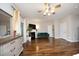 Main bedroom featuring a ceiling fan, hardwood floors, fireplace, and neutral walls and trim at 2921 Imperial Oaks Dr, Raleigh, NC 27614