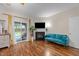 Bright main bedroom with hardwood floors, sliding glass doors to the backyard, and a fireplace at 2921 Imperial Oaks Dr, Raleigh, NC 27614