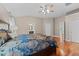 A spacious main bedroom with hardwood floors offers easy access to an ensuite bath and closet at 2921 Imperial Oaks Dr, Raleigh, NC 27614