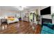 Bright main bedroom features hardwood floors, a fireplace, and a sliding glass door to the outside at 2921 Imperial Oaks Dr, Raleigh, NC 27614