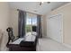 A well-lit office features a dark wood desk, large window, and neutral walls at 2921 Imperial Oaks Dr, Raleigh, NC 27614