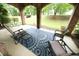 Relaxing covered brick patio with outdoor seating, a ceiling made of brick arches, and a garden view at 2921 Imperial Oaks Dr, Raleigh, NC 27614