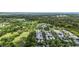 Panoramic aerial view of the community, showcasing lush greenery and pond at 3 Yancey, Pittsboro, NC 27312