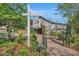 Charming barn entrance with sign, landscaping, and brick pathway at 3 Yancey, Pittsboro, NC 27312