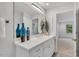 Bathroom boasts a white vanity with dual sinks and a decorative mirror with nice decor at 3 Yancey, Pittsboro, NC 27312
