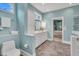 Bright bathroom with a toilet, towel rack, white cabinets, and a glass shower at 3 Yancey, Pittsboro, NC 27312