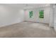 Bright bedroom with carpet, ceiling fan and two double hung windows at 3 Yancey, Pittsboro, NC 27312