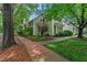 Charming home featuring lush landscaping, creating a welcoming and picturesque curb appeal at 3 Yancey, Pittsboro, NC 27312