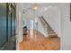 Inviting foyer featuring hardwood floors and a staircase leading to the second level at 3 Yancey, Pittsboro, NC 27312