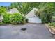 Detached two-car garage providing ample parking and storage space with privacy hedge at 3 Yancey, Pittsboro, NC 27312