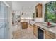 Spacious kitchen with stainless appliances, granite counters, wood cabinets, and breakfast island at 3 Yancey, Pittsboro, NC 27312