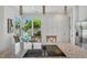 Bright kitchen featuring granite countertops, stainless appliances, cooktop island, and adjacent dining area at 3 Yancey, Pittsboro, NC 27312