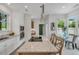 Kitchen with tile flooring, granite countertops, stainless steel appliances, an island with barstool seating, and a dining nook at 3 Yancey, Pittsboro, NC 27312