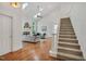 Open-concept living room showcasing stairs to the second floor and lots of natural light at 3 Yancey, Pittsboro, NC 27312