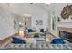 Bright living room with vaulted ceilings, fireplace, and elegant decor at 3 Yancey, Pittsboro, NC 27312