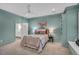 Spacious main bedroom with ceiling fan, plush carpet, and ensuite bathroom access at 3 Yancey, Pittsboro, NC 27312