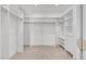 Spacious walk-in closet with custom built-in shelves and clothing racks at 3 Yancey, Pittsboro, NC 27312