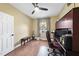 Bedroom featuring a ceiling fan, laminated floors, a window, and a work desk at 30 Cornerstone Dr, Franklinton, NC 27525