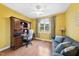 Bedroom with a ceiling fan, laminated floors, and a work desk area with a window at 30 Cornerstone Dr, Franklinton, NC 27525