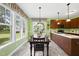 Bright dining area with a view showcases an elegant chandelier and a table at 30 Cornerstone Dr, Franklinton, NC 27525