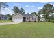 Single-story home features a well-manicured lawn and attached garage, offering suburban charm at 30 Cornerstone Dr, Franklinton, NC 27525
